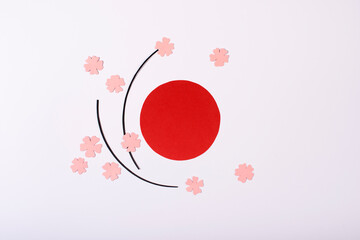 Red sun and pink flowers isolated on white background. Paper design for Japan National Foundation day.