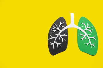 Ill and healthy lungs made of paper on color background