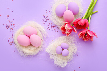 Composition with beautiful Easter eggs on color background