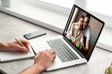 Family multi generational using conference application for meeting - Video call headshot from...