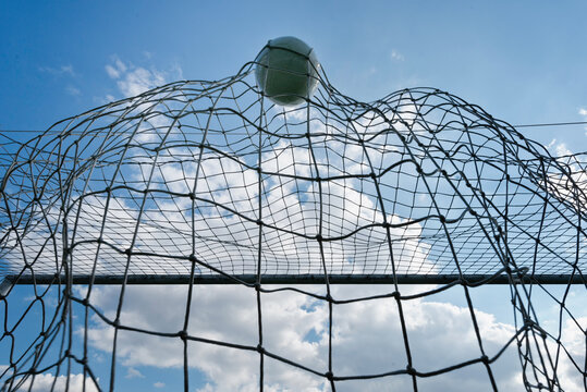 Low Angle View Of Soccer Ball In Goal Post