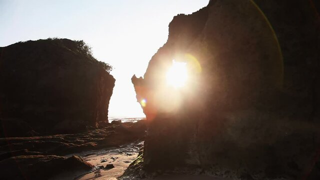 Wild caves in Bali beach at sunrise