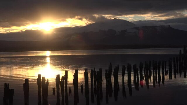 Patagonia. Chile. Sunset over Old Landing Stage in Puerto Natales.
