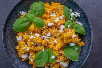Creamy roasted pumpkin penne pasta on a table