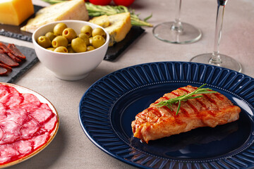 Grilled beef steak served on blue plate