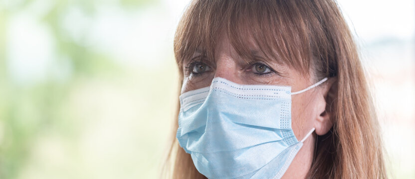 Mature Woman Wearing A Medical Face Mask