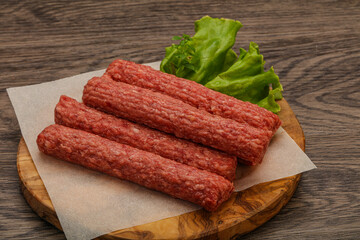 Raw beef sausages with spices