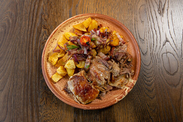 Roasted lamb meat served with fried potato