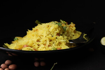 Indian Breakfast aalu Poha Also Know as kande Pohe made up of Beaten Rice or Flattened Rice.