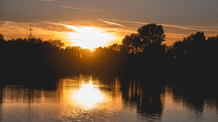 Beautiful sunset with reflections near Plattling, Isar, Bavaria, Germany