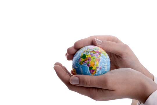 Close-up Of Hands Holding Globe Against White Background