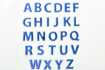 Set of shiny blue glossy letters, isolated on white background.