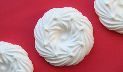 delicious italian dessert white meringues on a pink background