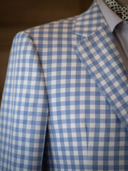 Close up of light blue casual jacket suit blazer with ascott scarf