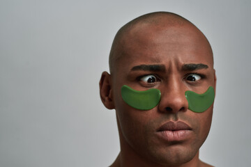 Person looking at his nose with funny expression