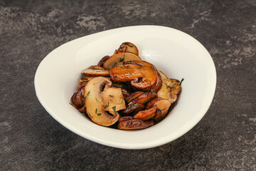Roasted champignon with herbs and spices