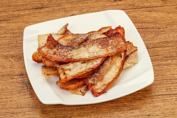 Roasted juicy bacon in the plate