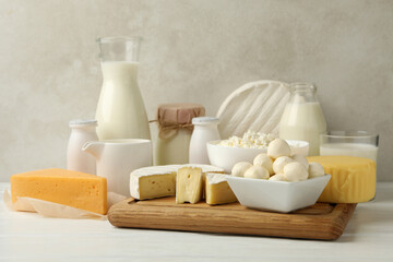 Fototapeta na wymiar Different fresh dairy products on white wooden table