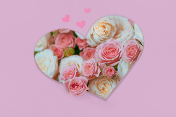 beautiful pink and white roses in the shape of a heart, background 