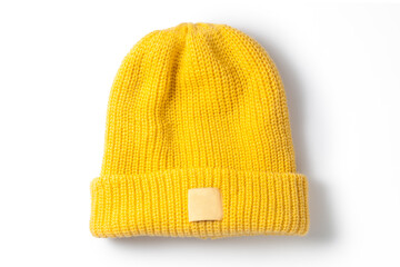 Yellow knitted hat isolated on white background