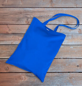 Blank Blue Tote Eco Bag Canvas  Shopping . On Wooden Table.