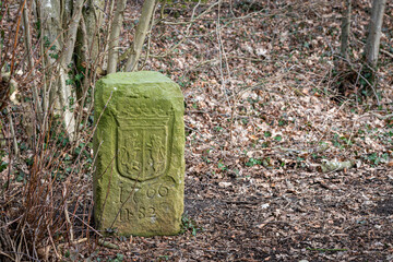 Old border marker on the border of the Netherlands and Germany.
