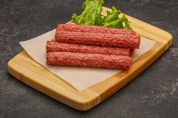 Raw beef sausages with spices