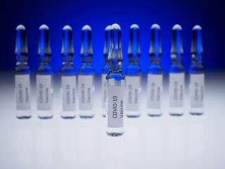Coronavirus vaccination concept. Ampoules with liquid. Selective focus. Vaccine against covid-19. Graft