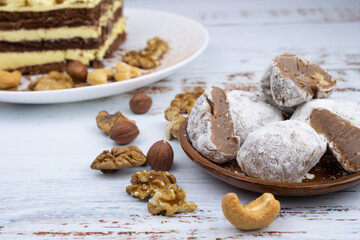Chocolate truffles with walnuts, milk candy with walnuts, creamy cashew fudge, sweet dessert, layer cake, tiramisu, striped honey cake,