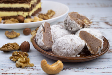 Chocolate truffles with walnuts, milk candy with walnuts, creamy cashew fudge, sweet dessert, layer cake, tiramisu, striped honey cake,