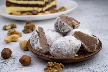 Chocolate truffles with walnuts, milk candy with walnuts, creamy cashew fudge, sweet dessert, layer cake, tiramisu, striped honey cake,