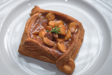 Freshly baked homemade little croissants with macadamier and caramel