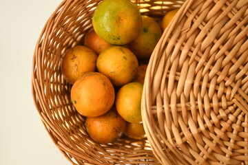 orange juice with fruits in the wooden bowl white background