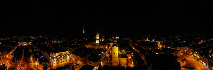 Fototapeta na wymiar View on Lviv city hall at night from drone