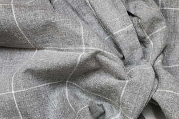 Gray cotton fabric with a white check pattern.