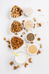 Fresh vegan alternative nut milk in glass on white background