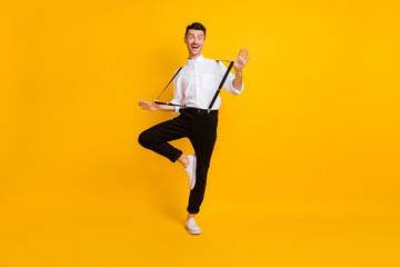 Fototapeta na wymiar Full length body size photo dancing at party enjoying music gentleman isolated on bright yellow color background