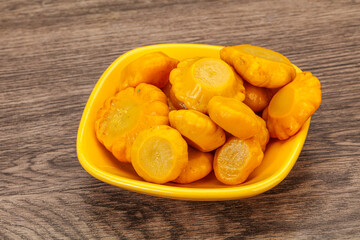 Marinated yellow patisson in the bowl