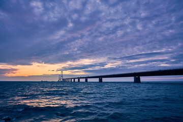 Fototapeta na wymiar long bridge at night with beautiful sunset
