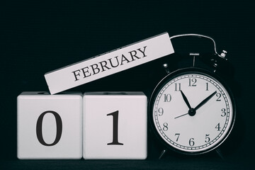 Important date and event on a black and white calendar. Cube date and month, day 1 February. Winter season.