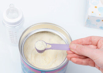 Preparation of mixture baby feeding on light background