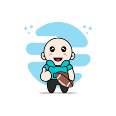 Cute kids character holding a rugby ball.