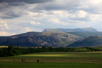 Beautiful summer landscape with a view of the valleys, green meadows and mountains in Crimea