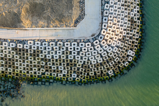 Aerial view of the breakwater at St. Mateus harbour on Terceira island. Azores archipelagos, Portugal.