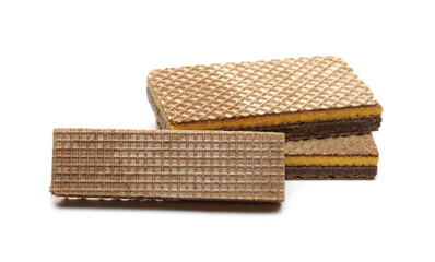 Wafer bars filled with cocoa and orange cream isolated on white background