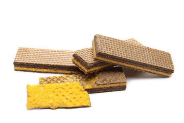 Wafer bars filled with cocoa and orange cream isolated on white background
