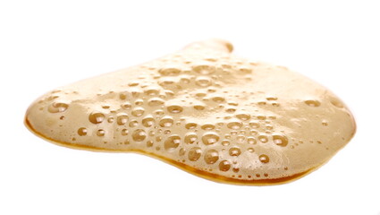 Beer puddle with froth isolated on white background