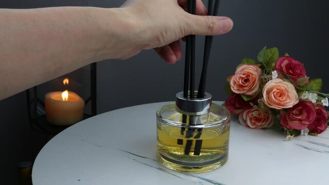 luxury aromatic scent of reed diffuser glass bottle is used as room freshener on the marble table in the bedroom to creat relax and romantic ambient on valentine day