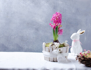 Easter composition with spring flowers, eggs and nest. Easter concept with copy space.