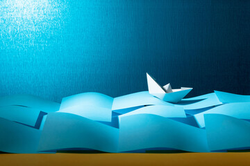 Paper ship in the paper sea. Concept of the theme of bureaucracy. © Igor Normann